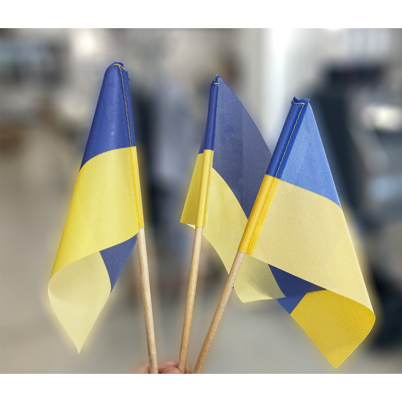 Ukrainian flag made of wood with a wooden handle